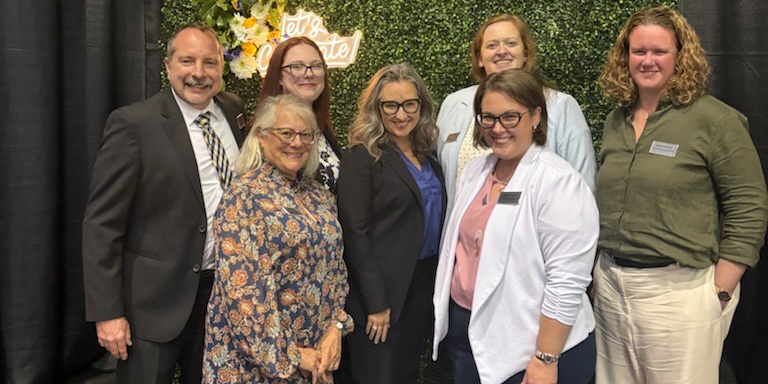 Seven members of College of Saint Mary's alumni council pose together.